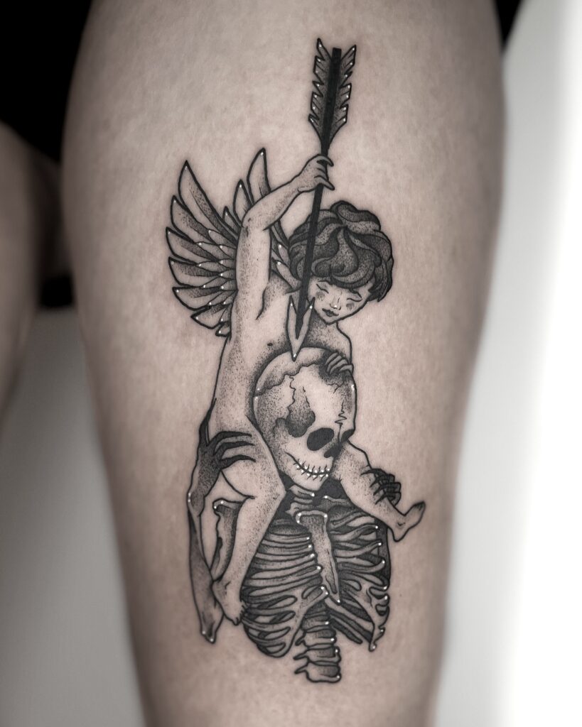 Dark and intricate blackwork tattoo featuring a cherub holding an arrow, riding a skeletal figure. This surreal and symbolic piece blends elemnts of life, death and mythology, making it perfect for those interested in gothic tattoos, angel tattoos or memento mori designs.